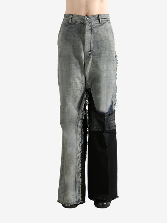 Grey jeans worn by a person, showing the jeans's fit