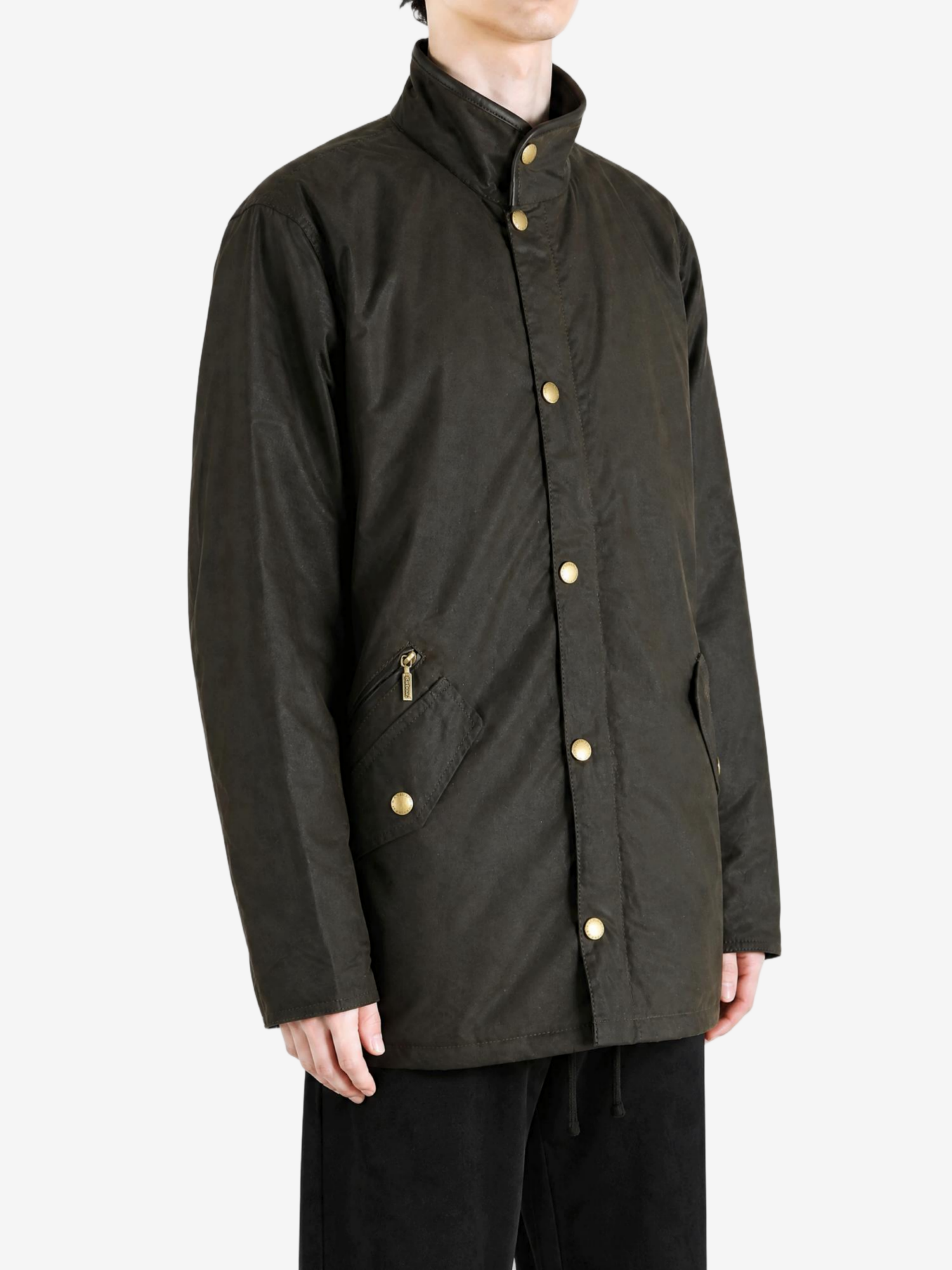Green jacket worn by a person, showing the jacket fit