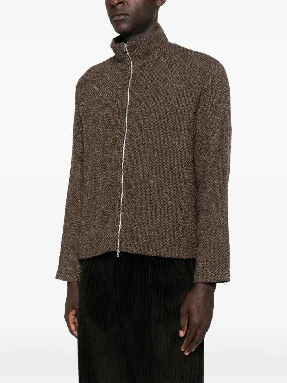 Brown coat worn by a person, showing the coat's fit