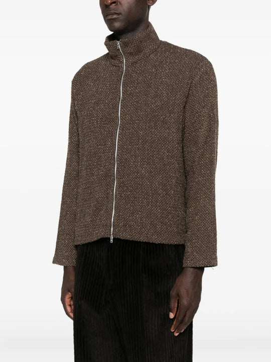 Brown coat worn by a person, showing the coat's fit