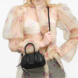 Black bag worn by a person, showing the bag fit