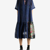 Navy dress worn by a person, showing the dress's fit