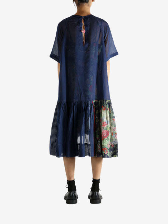 Navy dress worn by a person, showing the dress's fit