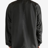Black jacket worn by a person, showing the jacket fit