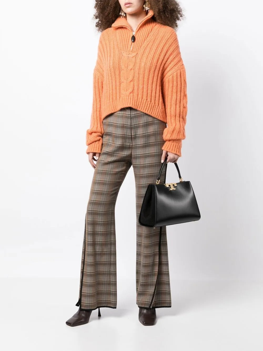 Black bags worn by a person, showing the bags' fit