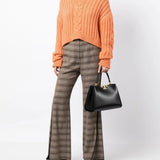 Black bags worn by a person, showing the bags' fit