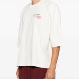 White t-shirt worn by a person, showing the t-shirt fit