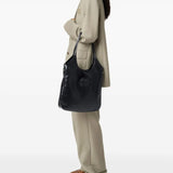 Black bags worn by a person, showing the bags fit