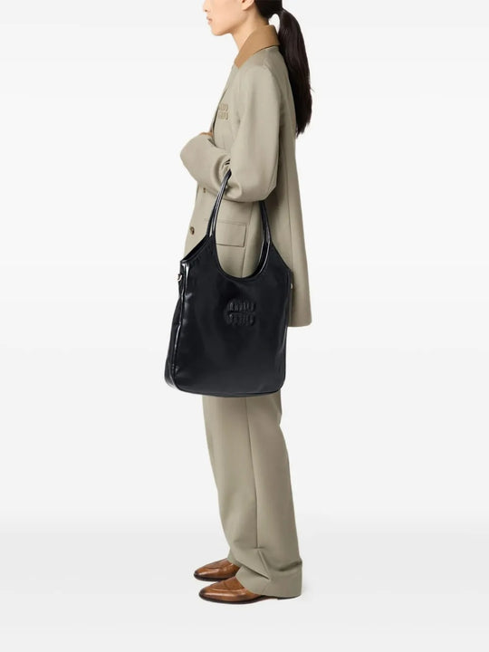 Black bags worn by a person, showing the bags fit