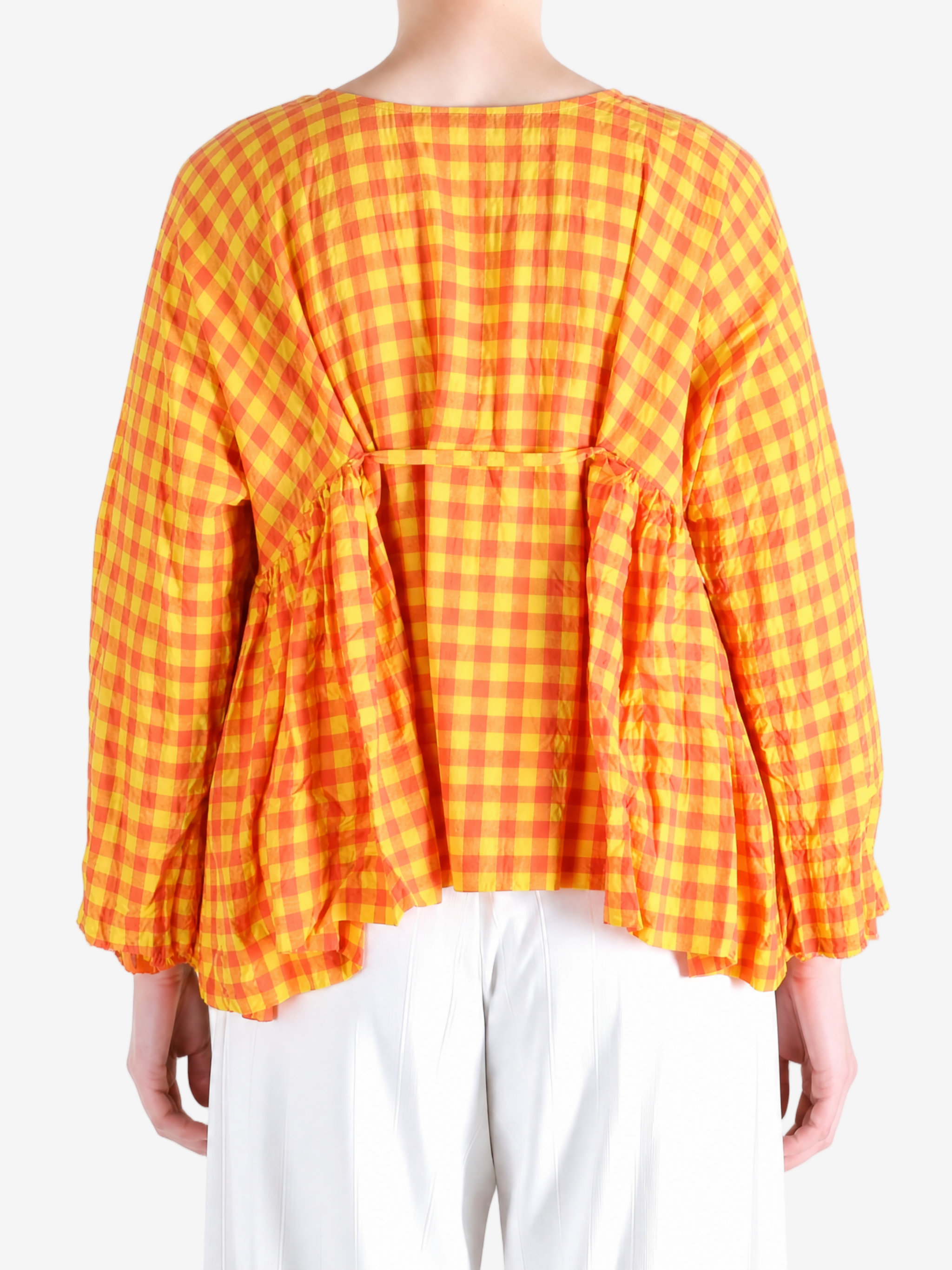 Orange shirt worn by a person, showing the shirt fit