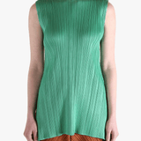 Green dress worn by a person, showing the dress's fit