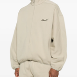 Grey jacket worn by a person, showing the jacket fit