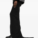 Black skirts worn by a person, showing the skirts fit