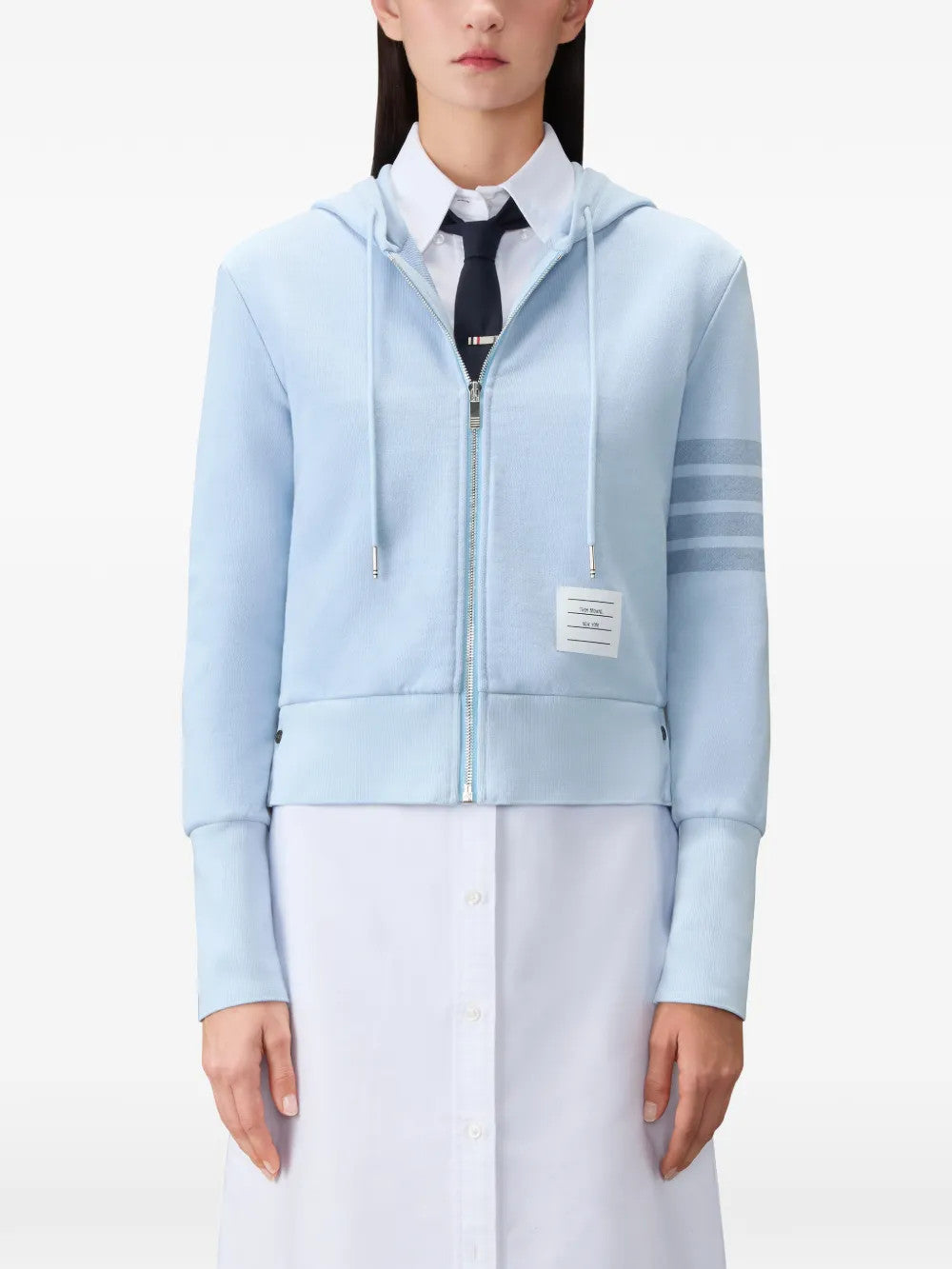 Blue hoodie worn by a person, showing the hoodie fit