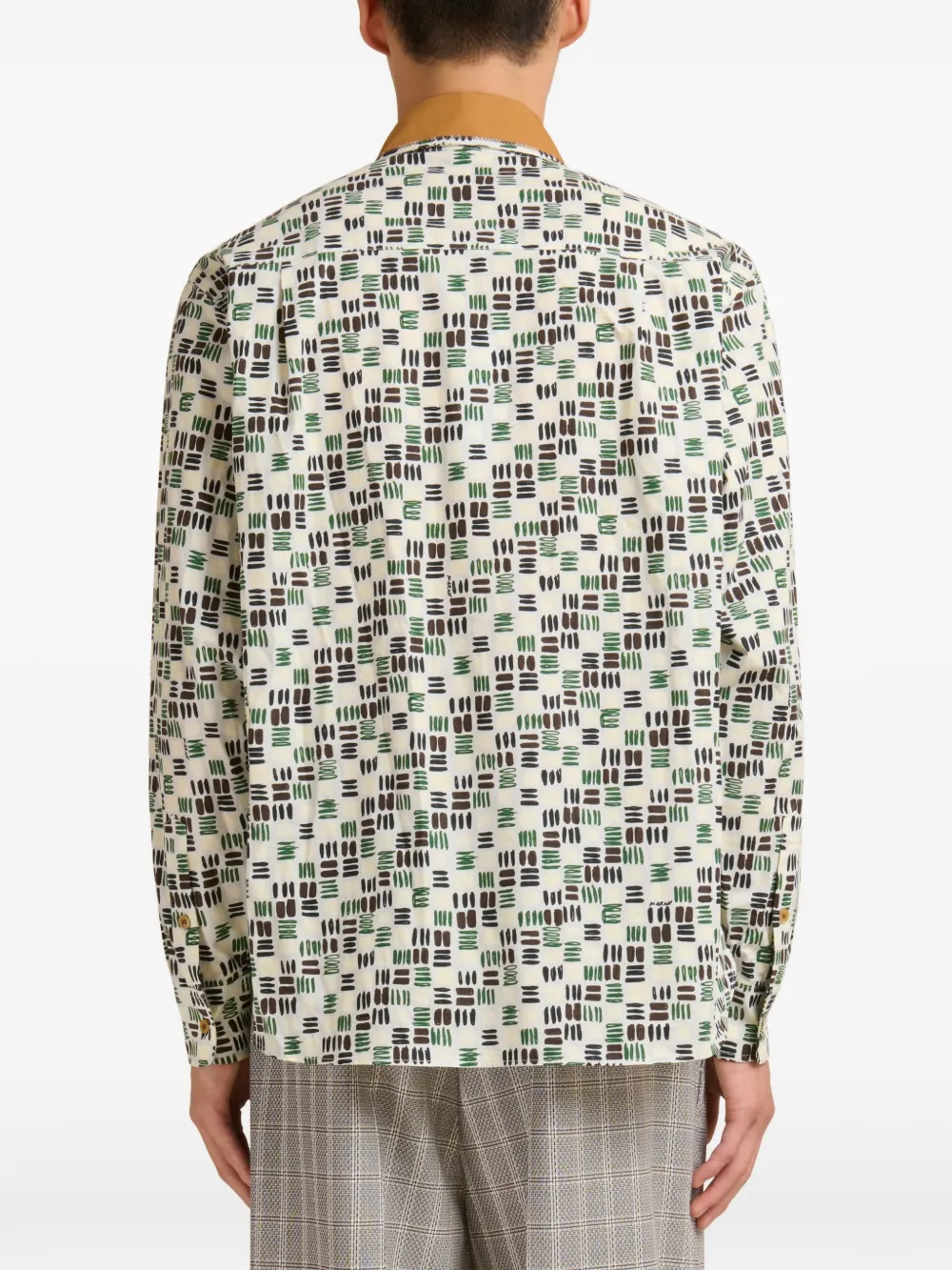 white shirt worn by a person, showing the shirt fit