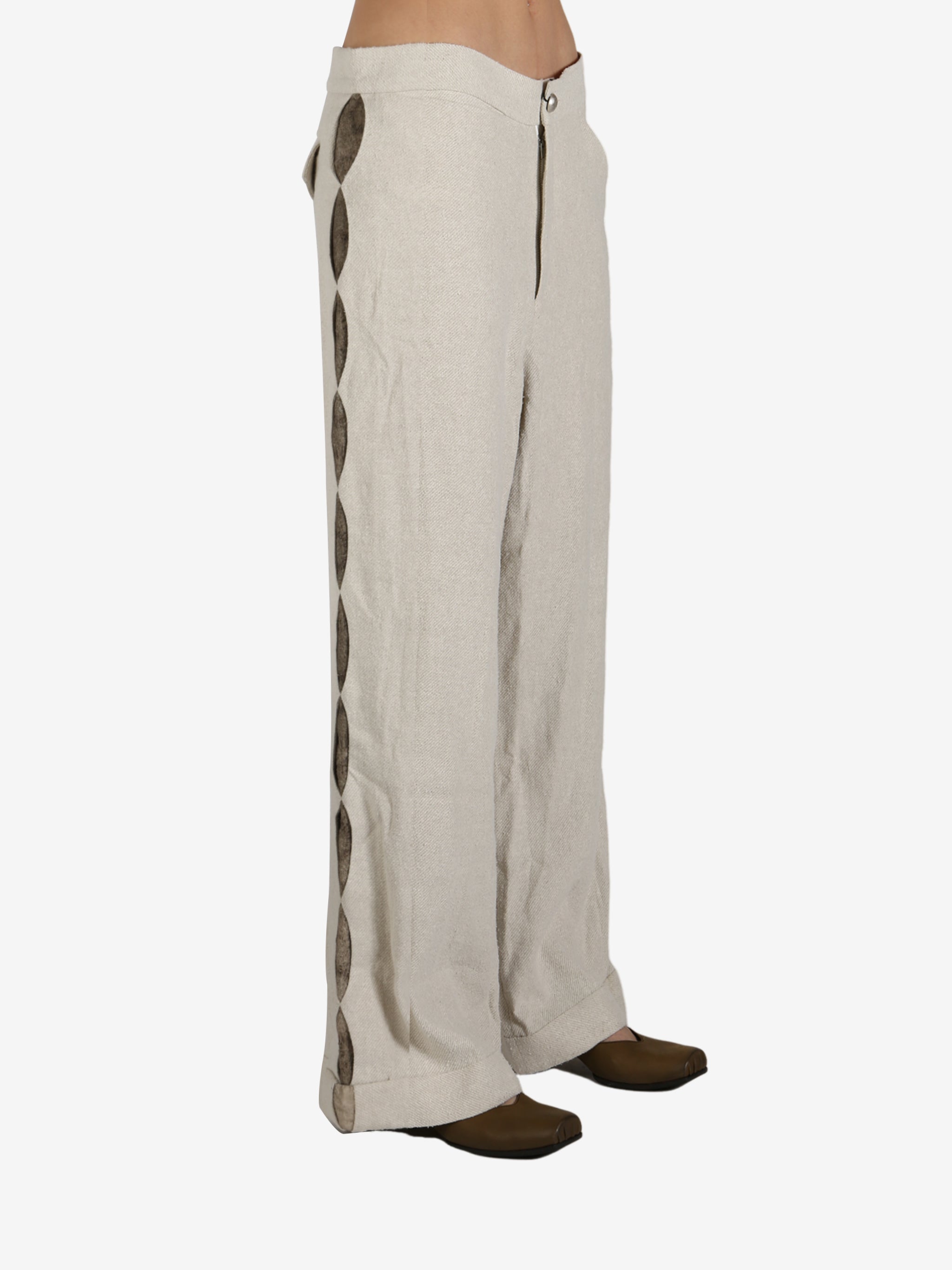 Tan pant worn by a person, showing the pant’s fit