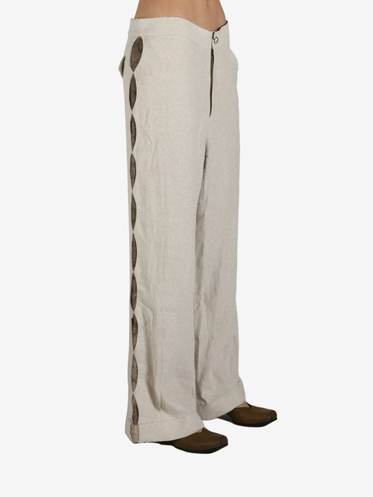 Tan pant worn by a person, showing the pant’s fit