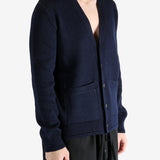 Navy cardigan worn by a person, showing the cardigan's fit