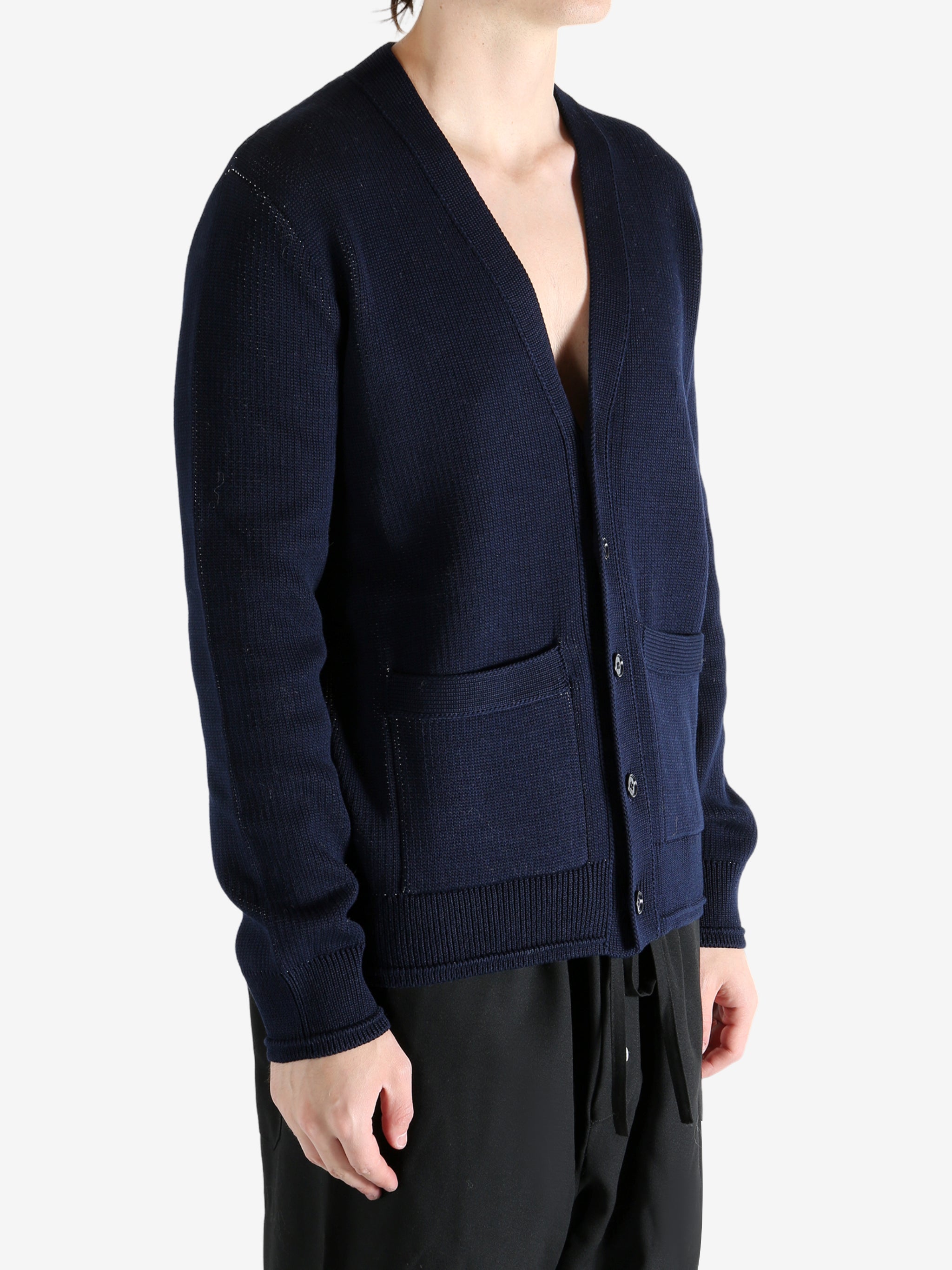 Navy cardigan worn by a person, showing the cardigan's fit