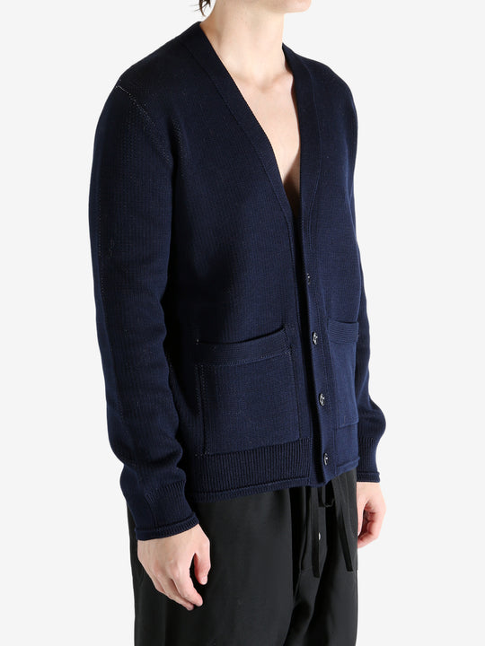 Navy cardigan worn by a person, showing the cardigan's fit