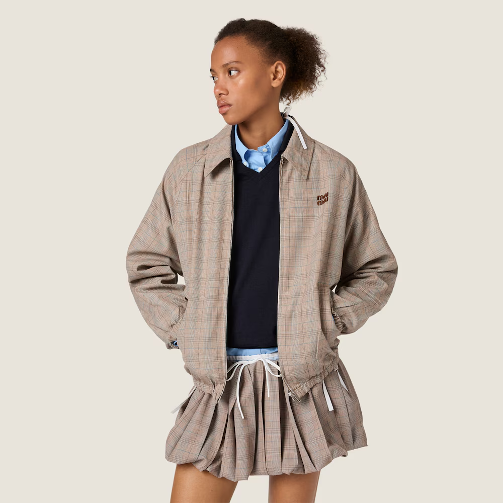 Tan jacket worn by a person, showing the jacket fit