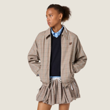 Tan jacket worn by a person, showing the jacket fit
