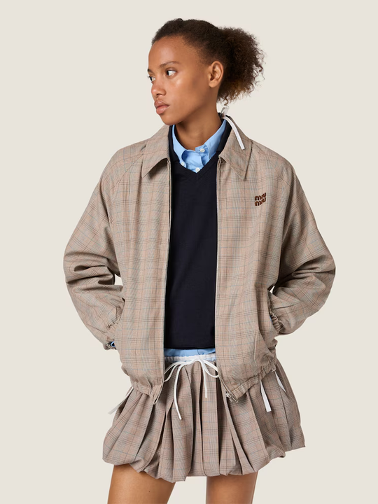Tan jacket worn by a person, showing the jacket fit