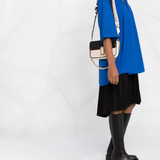 Pink bag worn by a person, showing the bag fit