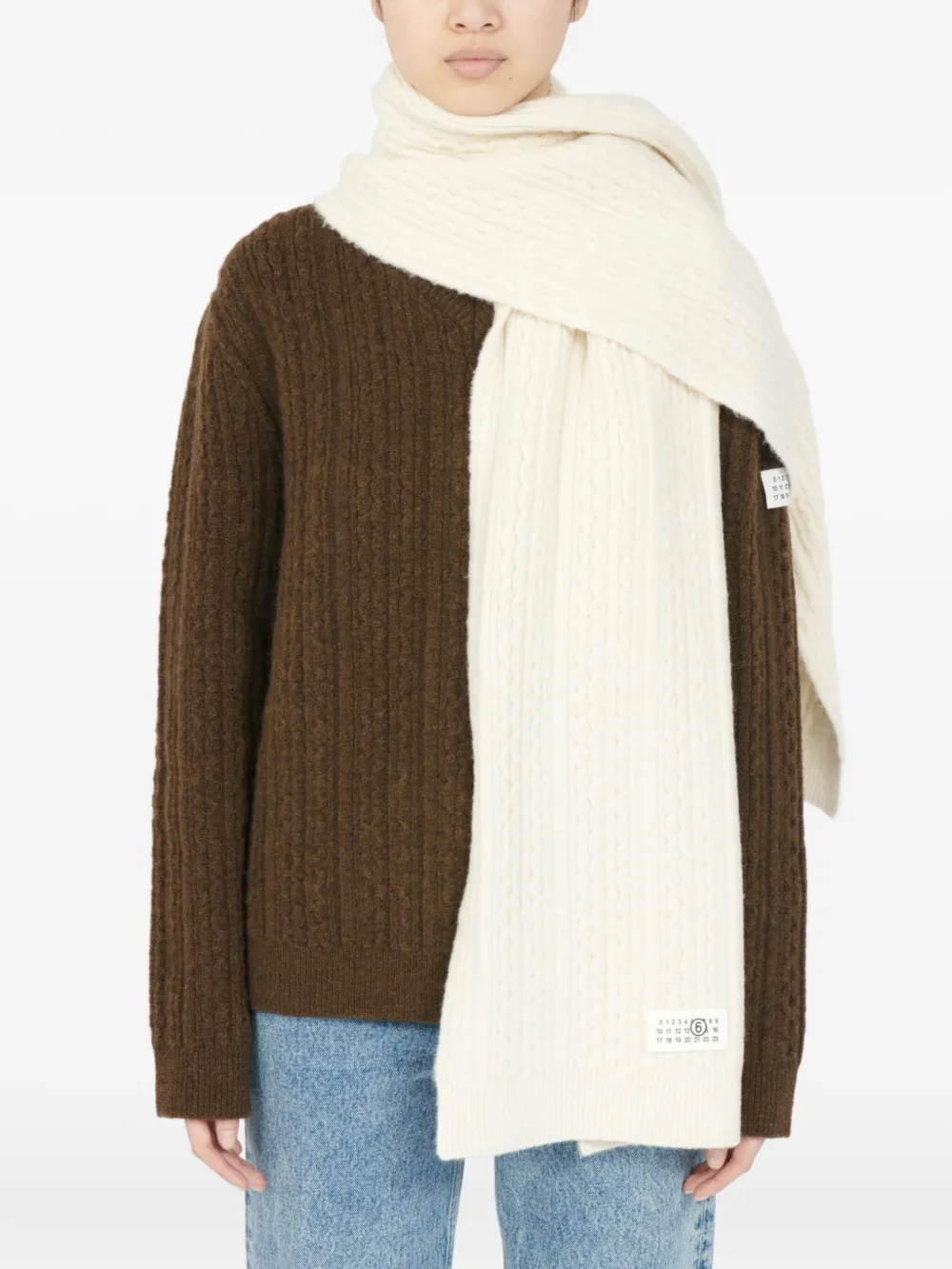 White scarf worn by a person, showing the scarf's fit