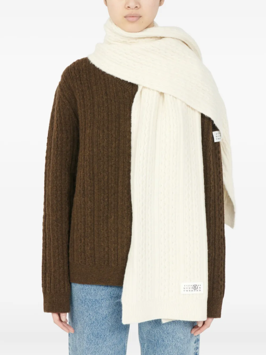 White scarf worn by a person, showing the scarf's fit