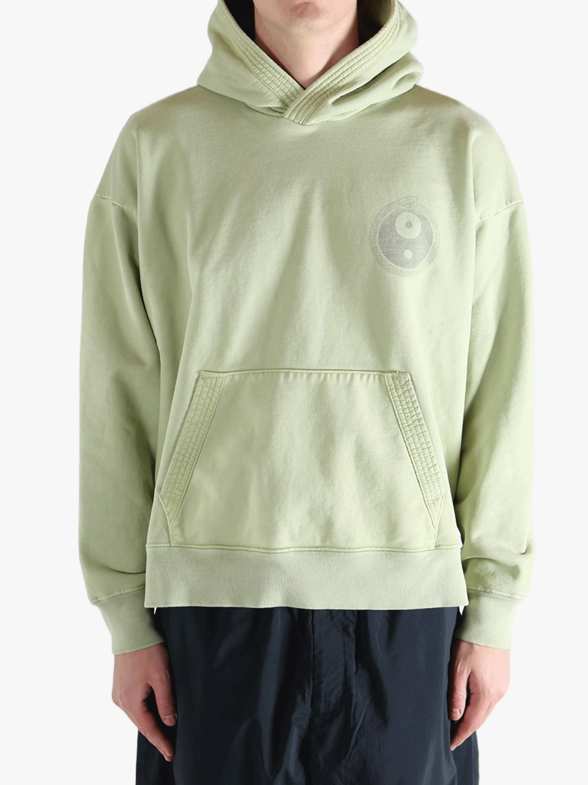 Green hoodie worn by a person, showing the hoodie's fit