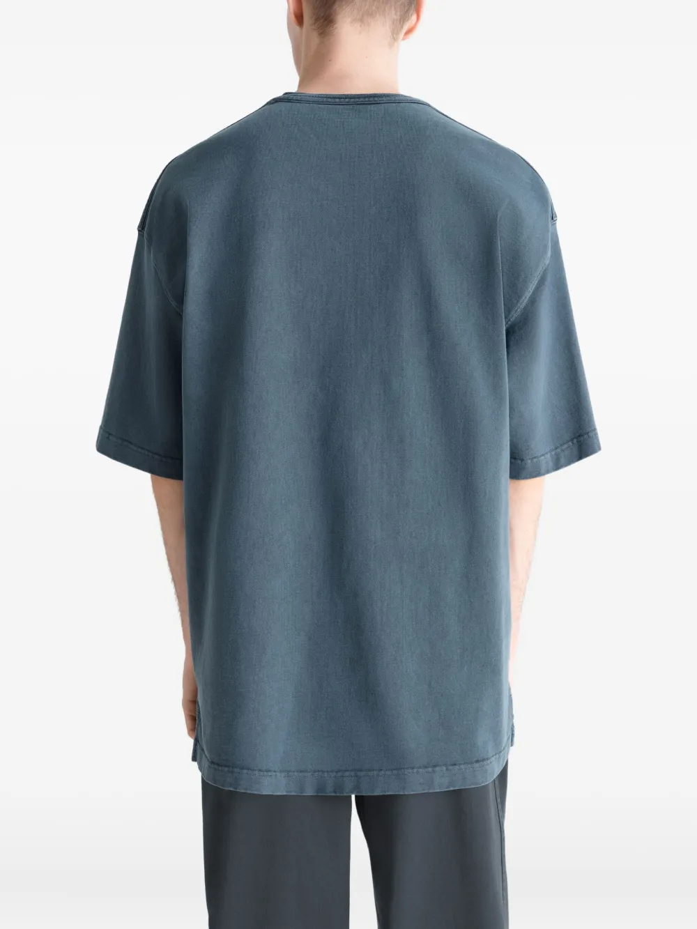 Blue t-shirt worn by a person, showing the t-shirt's fit