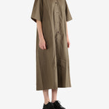 Brown dress worn by a person, showing the dress's fit