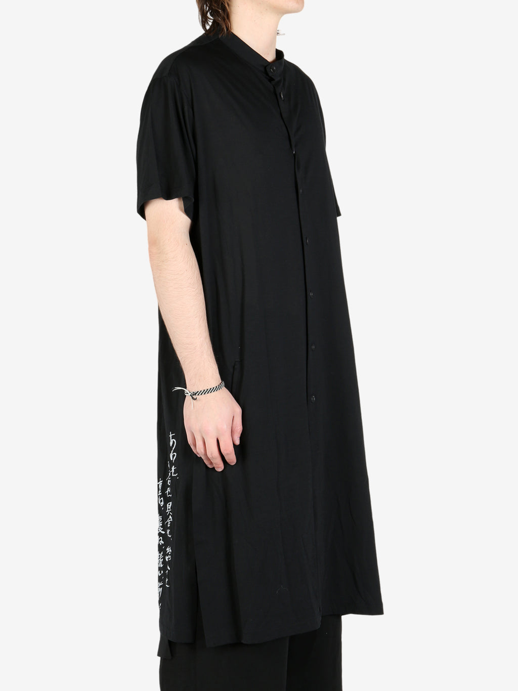 Black vest worn by a person, showing the vest's fit