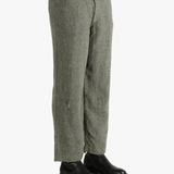 Grey pants worn by a person, showing the pants fit