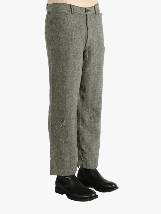 Grey pants worn by a person, showing the pants fit