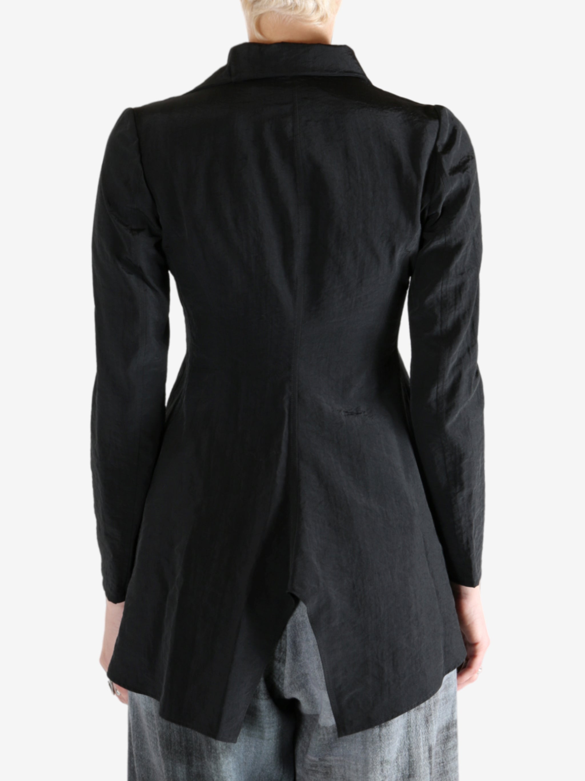 Black jacket worn by a person, showing the jacket's fit