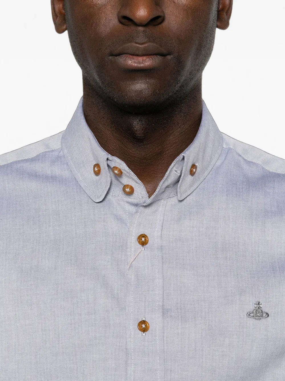 Blue shirt worn by a person, showing the shirt fit