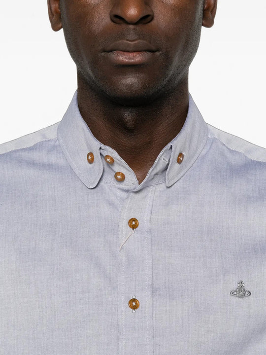 Blue shirt worn by a person, showing the shirt fit