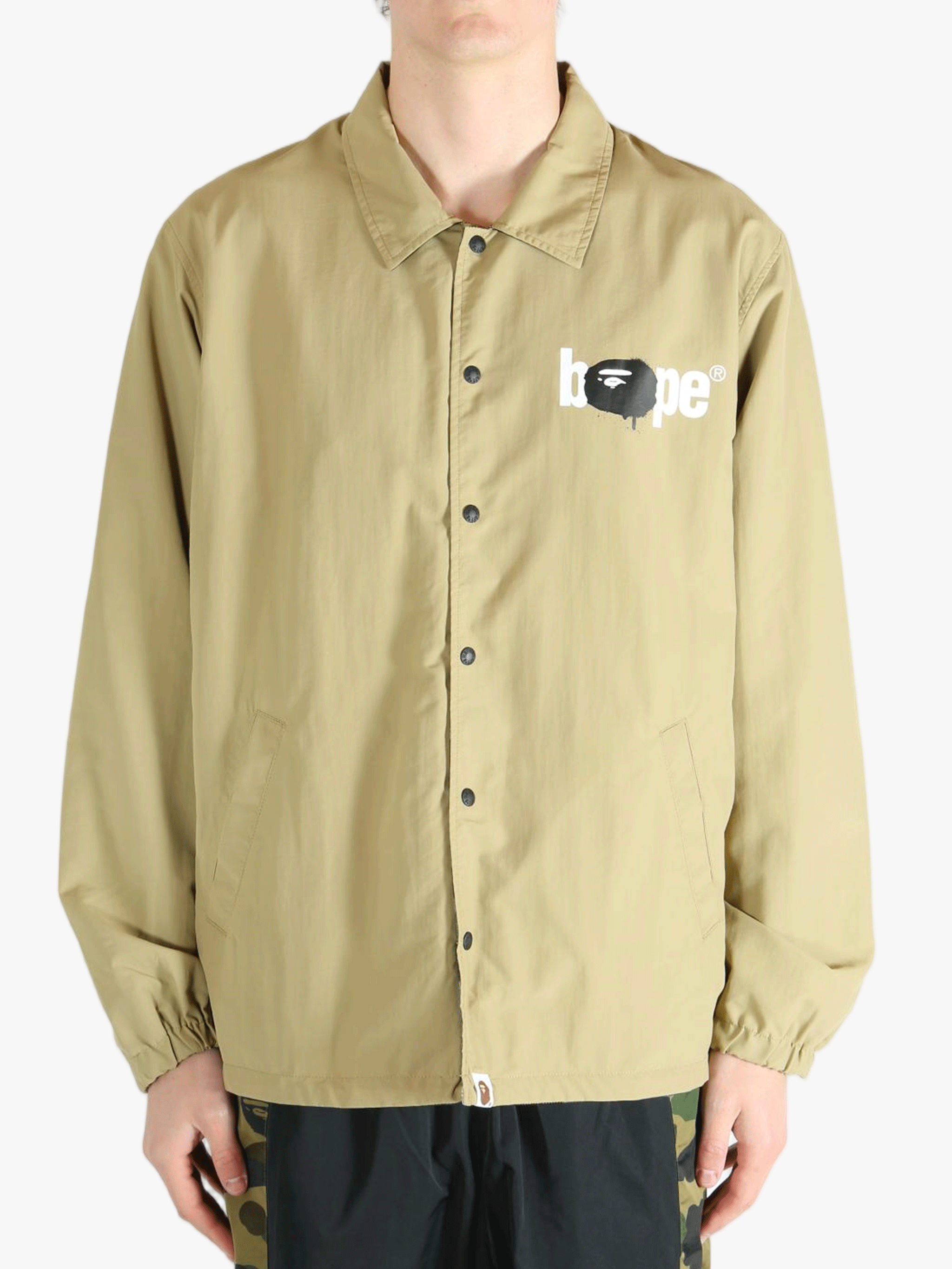 Tan jacket worn by a person, showing the jacket's fit