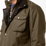 Green jacket worn by a person, showing the jacket fit