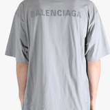 Grey t-shirt worn by a person, showing the t-shirt's fit