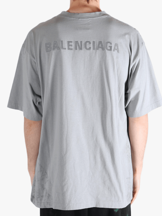 Grey t-shirt worn by a person, showing the t-shirt's fit