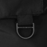 Close up of the black jacket, showing texture of the polyester fabric