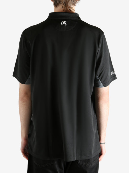 Black shirt worn by a person, showing the shirt's fit