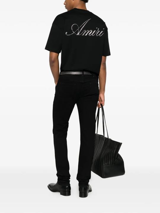 black t-shirt warn a person,showing the t-shirts fit