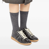 Brown shoes worn by a person, showing the shoes fit