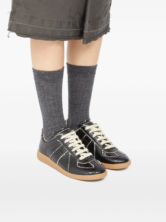 Brown shoes worn by a person, showing the shoes fit