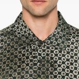 Green shirt worn by a person, showing the shirt fit