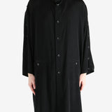 black jackets-coats worn by a person, showing the jackets-coats fit